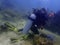 Irresponsibility underwater photographer whom step on the coral reefs during a leisure dive in Tunku Abdul Rahman Park, Kota Kinab