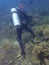 Irresponsibility underwater photographer whom step on the coral reefs during a leisure dive in Tunku Abdul Rahman Park, Sabah.