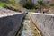 Irrigation canal called falaj in Muscat neighborhood, Oman