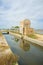 Irrigation canal through rice fields