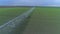 Irrigation equipment for green rapeseed watering on agriculture field, drone view on countryside