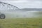 Irrigation by Pivot sprinkler on misty field