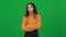 Irritated bored teenage girl rolling eyes gesturing saying bla-bla on green screen. Portrait of annoyed African American