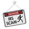 IRS scam danger sign over white