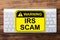 IRS Scam Warning Sign On Keyboard