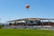 IRVINE, CALIFORNIA - 30 AUG 2020: The Orange County Great Park Balloon and soccer stadium sporting a COVID-19 face mask and