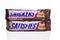 IRVINE, CALIFORNIA - 6 OCT 2020: Two Snickers Candy Bars from Mars, one says Snickers the other label reads Satisfies