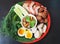 Isaan Thai food set with Fresh vegetables, boiled eggs, grilled pork and chili paste