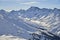 Ischgl mountain panorama. Sunny winter day in alpine ski resort.