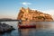 Ischia, Italy June 20, 2017: Boatman with a boat on the background of the Aragonese castle