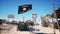 ISIS flag on terrorist base, headquarters. Desert landscape. Terrorism concept.