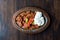 Iskender Doner / Turkish Traditional Food with Yogurt in Antique Copper Plate.