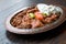 Iskender Doner / Turkish Traditional Food with Yogurt in Antique Copper Plate.