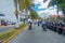 ISLA MUJERES - JANUARY 10, 2018: Outdoor view of some riders with some motorcycles parked in a row in the streets of the