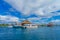 ISLA MUJERES, MEXICO, JANUARY 10, 2018: Outdoor view of ship in the shore with many passenger, close to a typical house