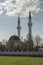 Islam Muslim mosque two minarets. Beautiful photo of mosque, place of worship. Ramadan Islamic religious architecture