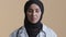 Islamic arabian woman female doctor cardiologist adviser in hijab talking at camera virtual video chat young arabian