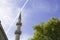 Islamic concept photo. Minaret and a tree.