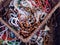 Islamic counter prayer beads with colorful pearls in islam closeup placed in wooden basket view from above for background pattern