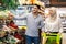 Islamic Couple Shopping Groceries Pointing Fingers Choosing Food In Supermarket