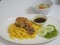 Islamic dish consisting of rice with buried chicken food, Chicken Biryani with green sauce