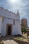 Islamic door and sunrays with keep tower of the castle in the background, Mértola PORTUGAL