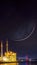 Islamic image. Ortakoy Mosque and Bosphorus Bridge with crescent moon