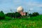 Islamic muslim Mosque against backdrop of blue sky and rice field