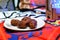 Islamic Ramadan month colorful background, dates fruit on a white plate and blurred Ramadan lanterns fanous with an Islamic rosary