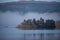 Islan in Loch Awe silouetted against the early morning mist