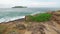 The island away from the coast video across the Strait. sea Bay of a tropical island. waves crashing against the shore.