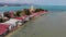 Island with Buddhist temple and many houses. Aerial view of island with Buddhist temple with statue Big Buddha surrounded by