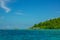 Island Covered with Jungle and Huts on the Water