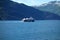 An island ferry approaching a port.