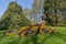 Island of flowers Mainau, Germany - April 19, 2019: Statue of erysimum flowers in the form of a firebird in a beautiful