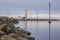 Island of Grotta in front of Reykjavik with reflections of power pylons and lighthouse on long exposure