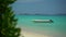 Island In Maldives - Boat Floating Over The Crystal Clear Sea Water. near the beach. Sunny day in paradise. Many island