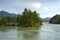 Island overgrown with pine trees on the Katun River