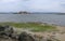 An island of Parakrama samudraya lake under cloudy sky in Polonnaruwa Sri Lanka