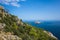 Island Suluada near Turkish coast of Mediterranean sea view from steep mountain, deep blue sea water, sunny day, Picturesque