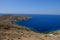 Island of Syros in greece, panorama of the kliff close to Delfini beach with land and sea.