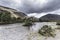 Island with tree in the middle of flowing stream.Scenic landscape of Lake District,Cumbria,Uk