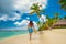 Island in the tropics. Happy walking girl enjoying tropical sandy beach, Saona island, Dominican Republic