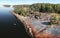 Island in Vyborg bay, aero view of clean nordic nature. Beautiful rocks and cliffs with woods in North Europe, Baltic sea, gulf of