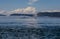 The islands and sea-going ferry are covered in fog.