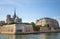 Isle de la Cite with Notre Dame Church seen from the boat from Seine River of Paris, France.