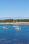 Isles of Scilly, United Kingdom - sailboats anchoring at Porthcressa Beach with Hugh Town in the background