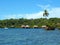 Islet and thatched cabins over the water