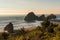 Islets protruding in the Pacific Ocean on a beach in Southern Oregon, USA