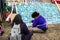 ISLINGTON, LONDON, ENGLAND- 18 November 2020: Save Our Trees protesters painting a mural at Dixon Clark Court